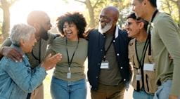 A team of charity workers embracing