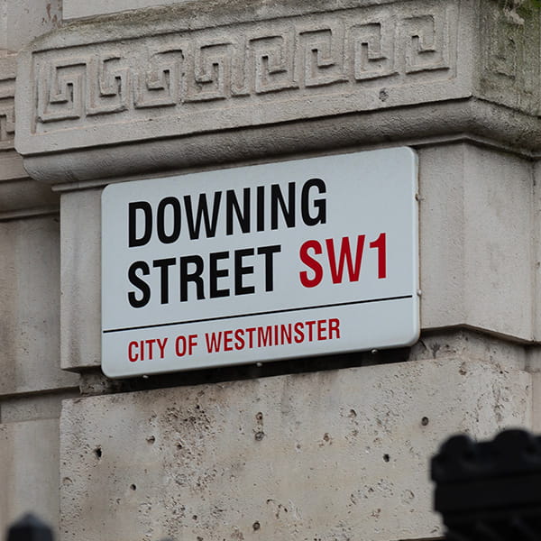 Image of a sign in London with Downing Street on it