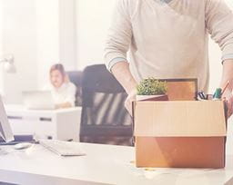 Boxing up belongings from a desk